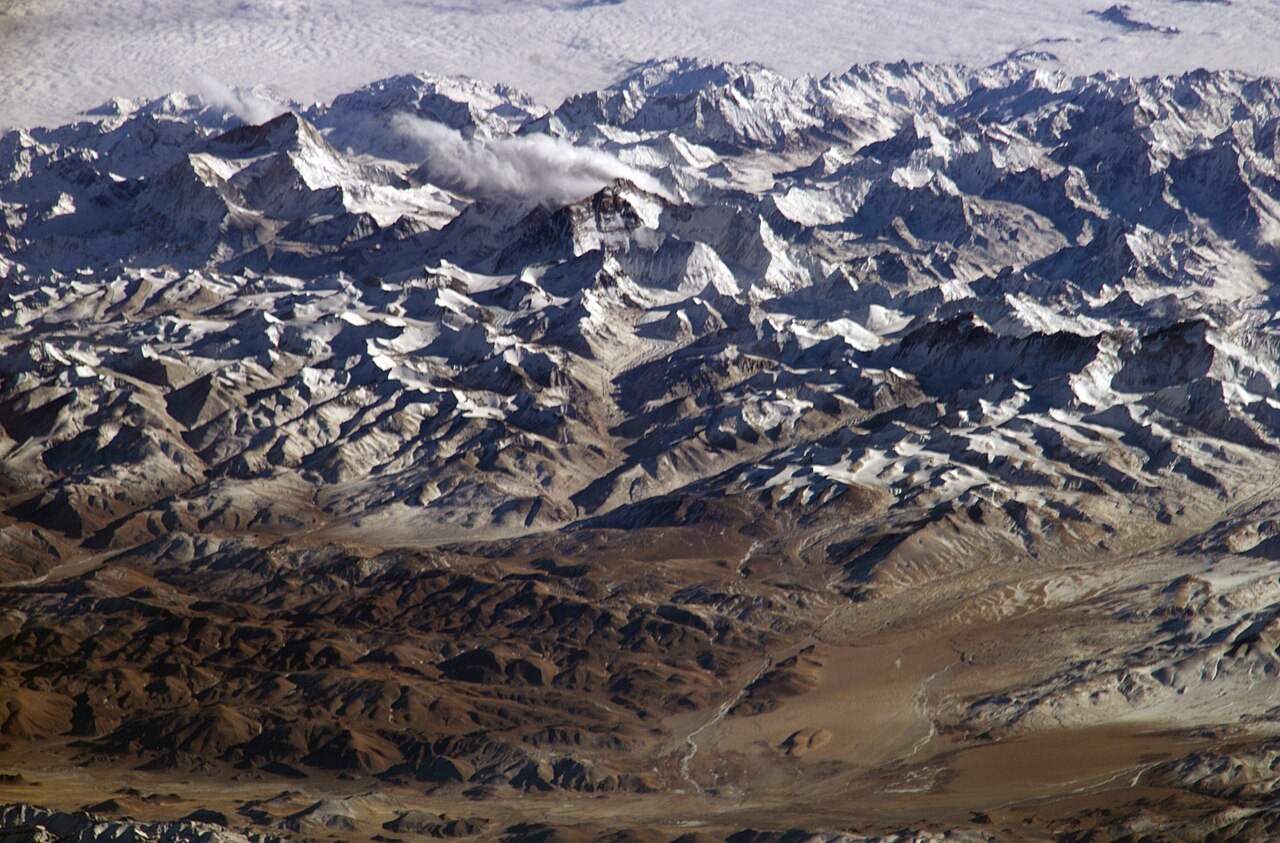 Snow-covered Himalayan peaks and valleys photographed from the International Space Station.