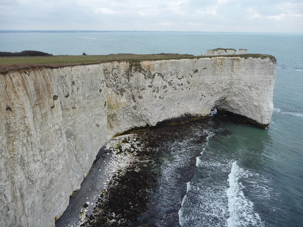 White chalk cliffs, offshore remnants and a wave-cut base near the Pinnacles in Purbeck.