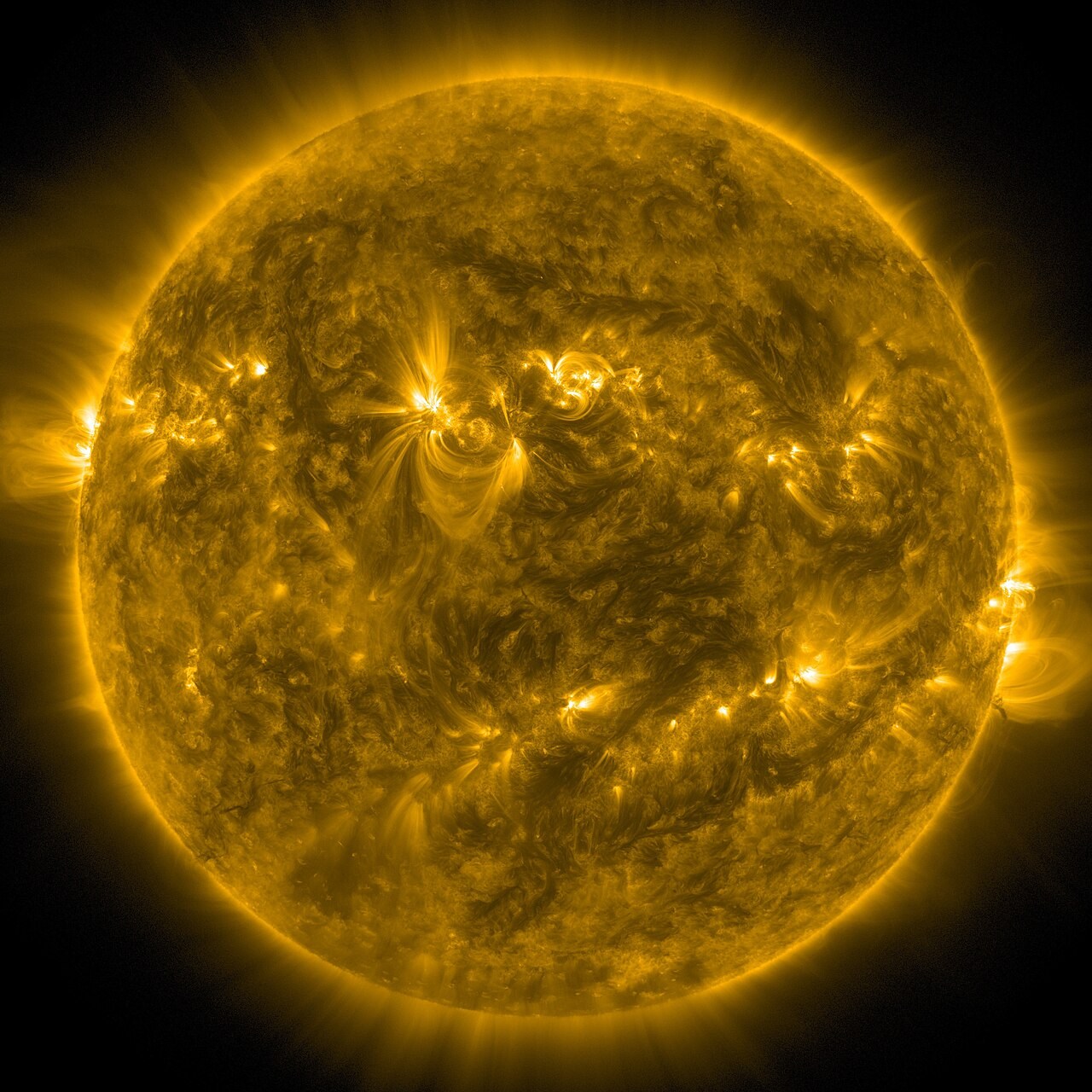 Extreme-ultraviolet observation of the full Sun showing bright active regions, displayed in yellow.