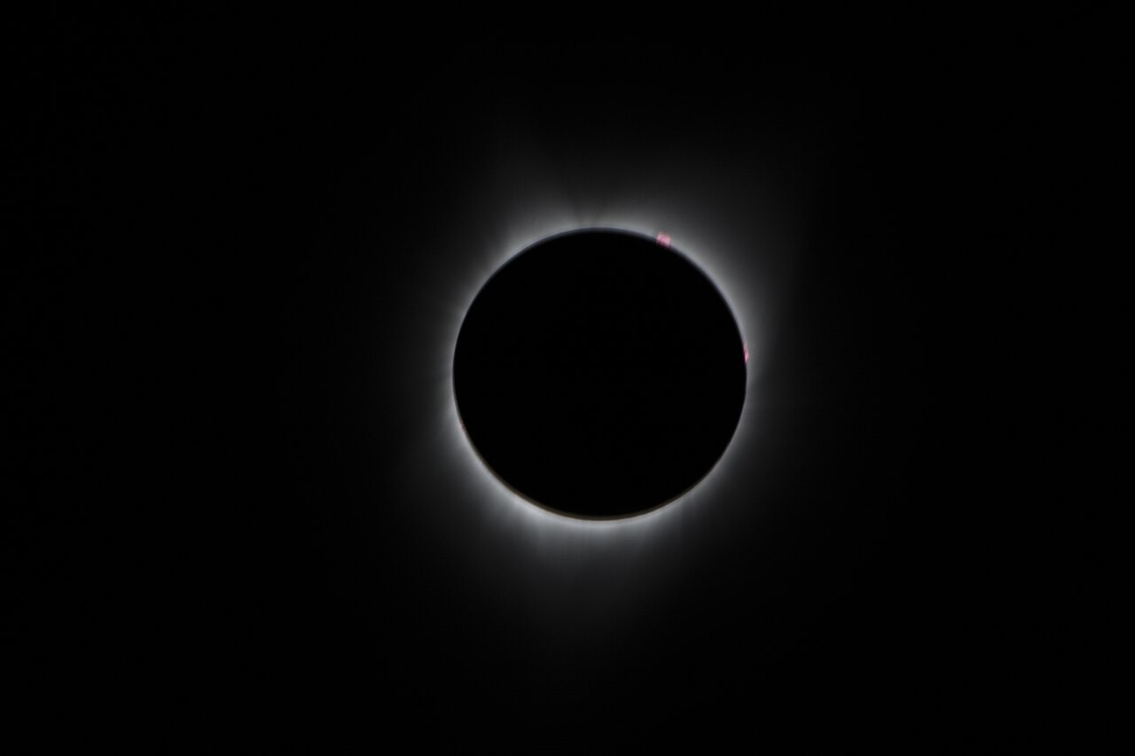 The dark lunar disc surrounded by the Sun's pale corona during the 2017 total solar eclipse.