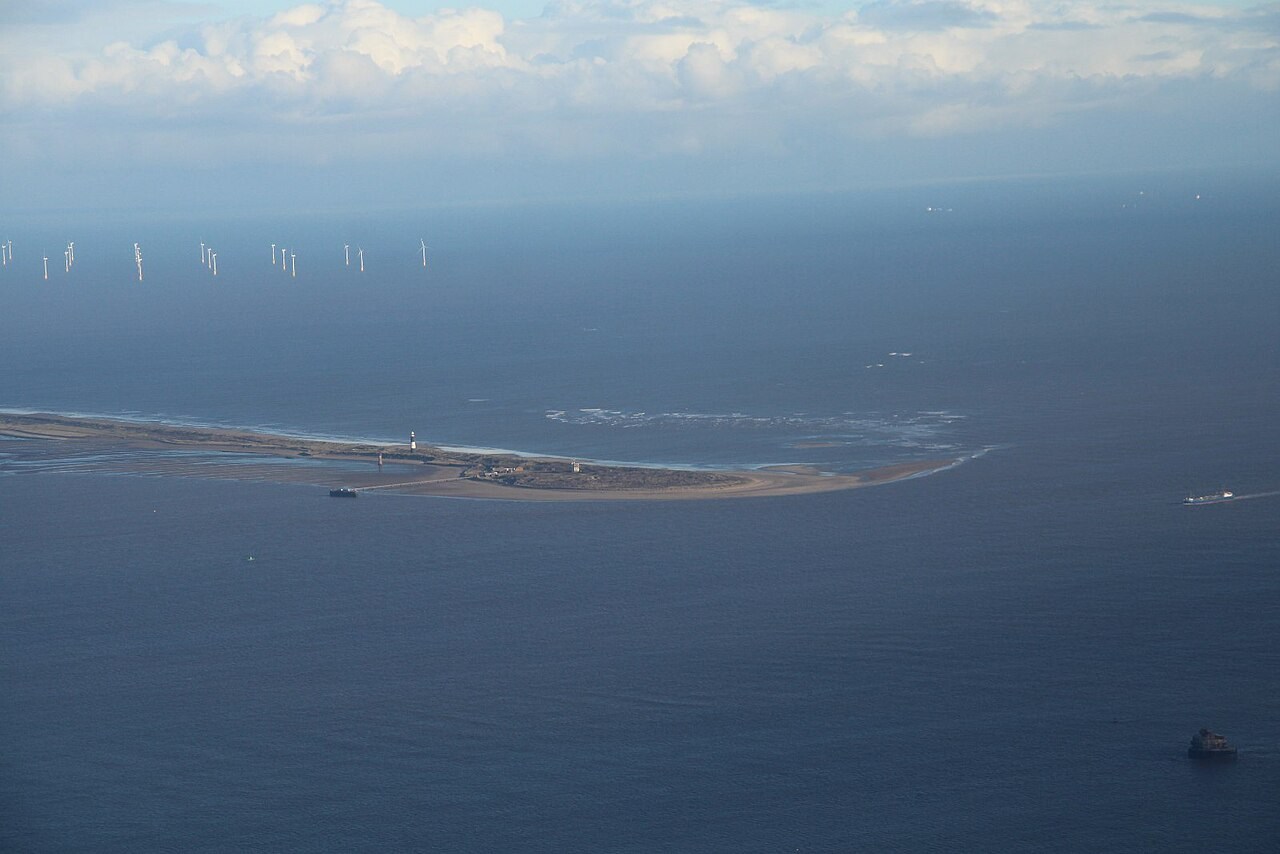 Aerial photograph of Spurn Point curving across the Humber estuary entrance.