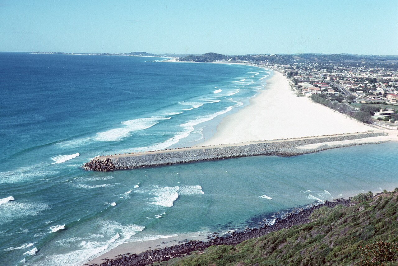 A groyne extends across the beach at Tallebudgera Creek on Australia's Gold Coast.